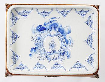 A rococo faience-top tea table, Rörstrand 1765.