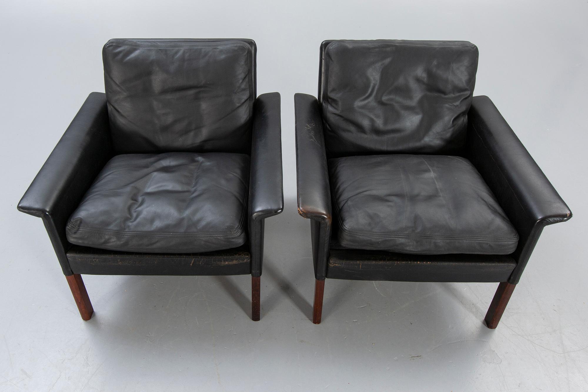A pair of 1960s leather easy chairs.
