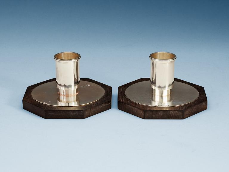 A pair of Wiwen Nilsson sterling and ebony candle sticks, Lund 1937.