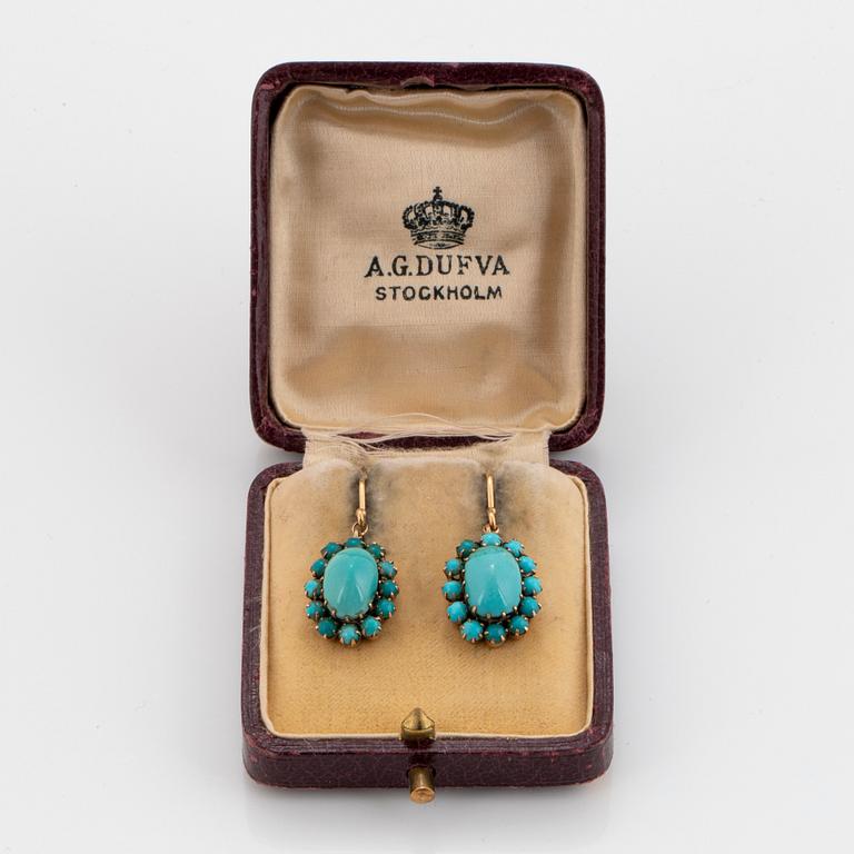 A pair of 18K and 9K gold earrings set with turquoises.