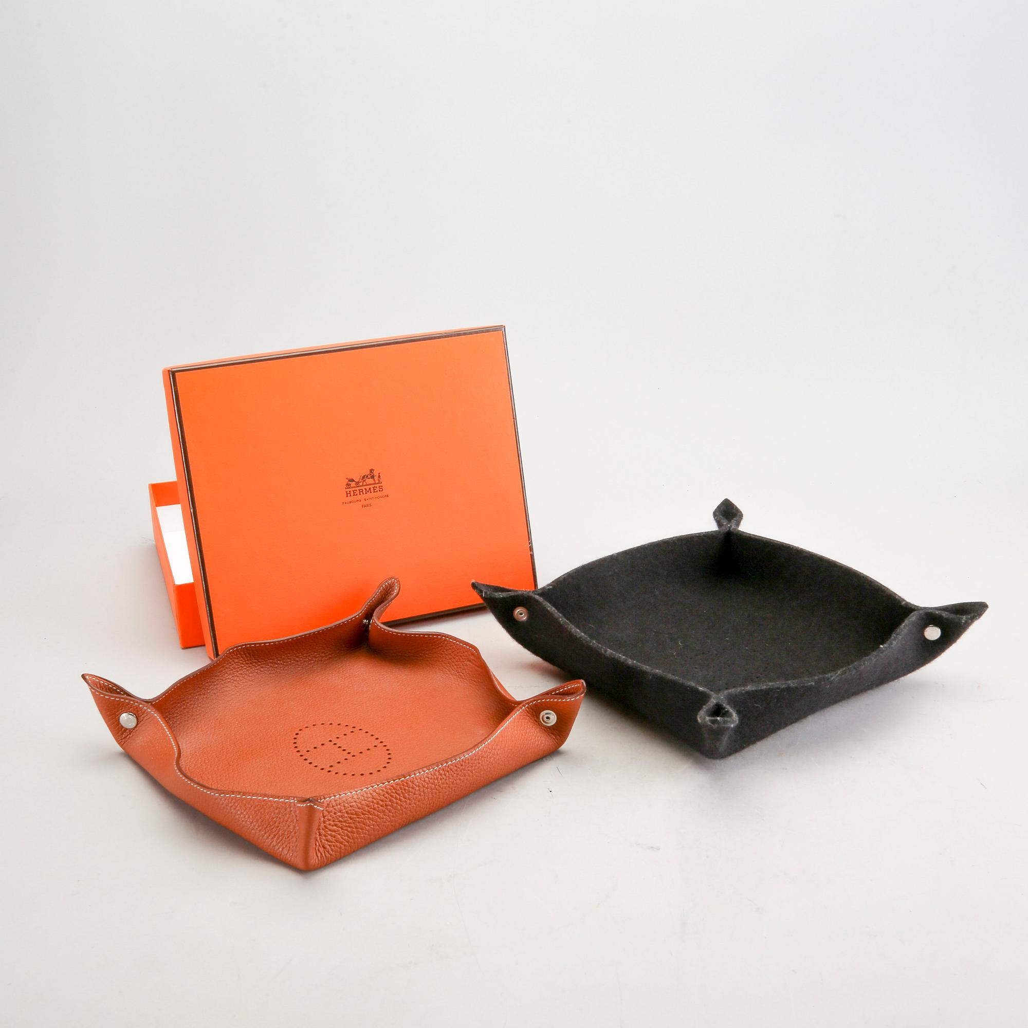 Hermès, a set of two leather and felt "Change trays".