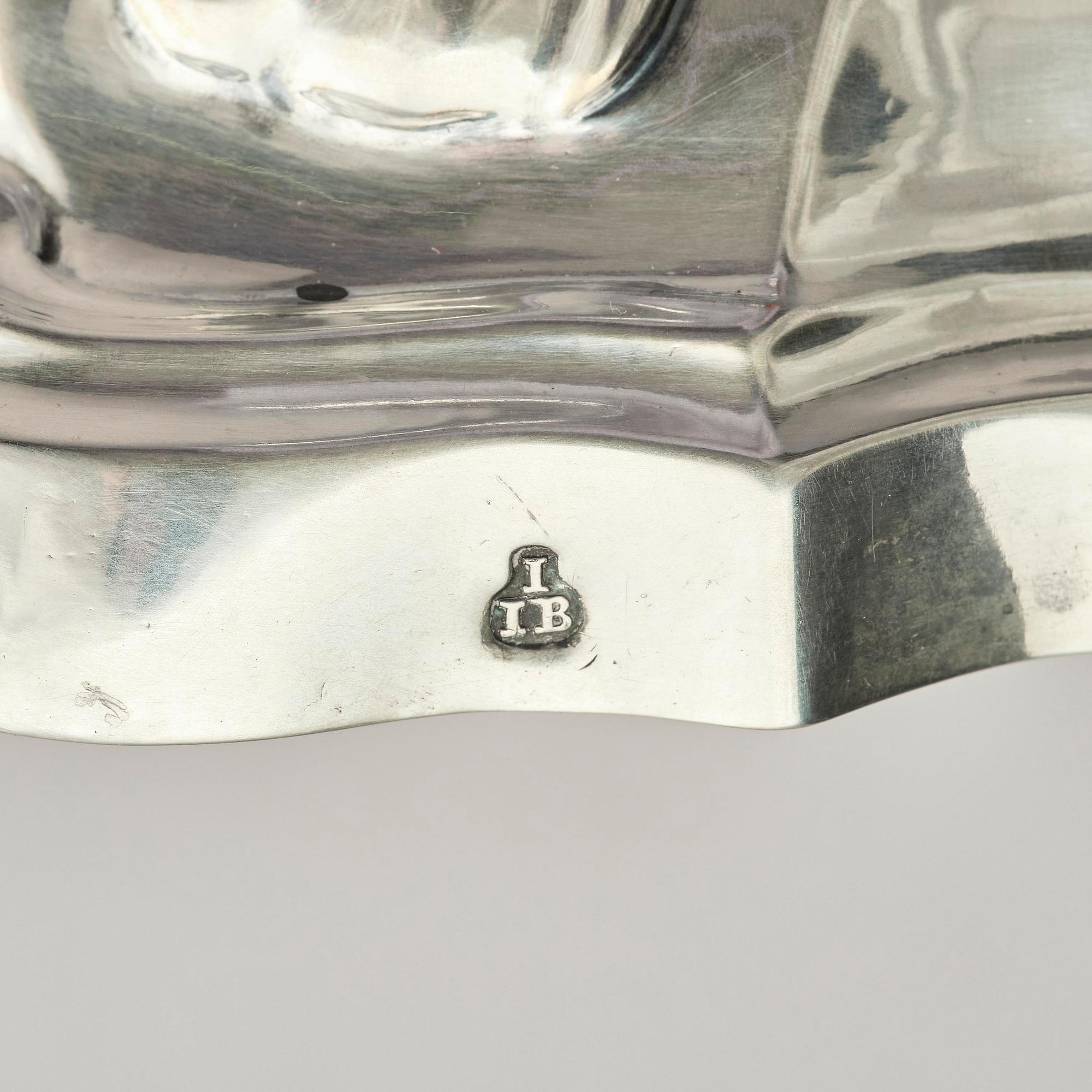 A pair of German silver Rococo candlesticks, marks of Johann Jacob Baur, Augsburg 1777-1779.