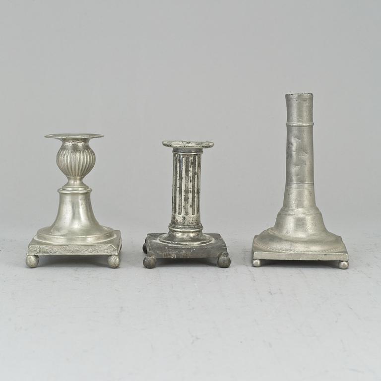 Three 19th century gustavian pewter candlesticks.