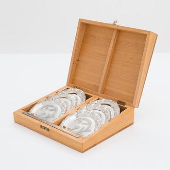 A set of six spruce cone motif coasters, Auran Kultaseppä, Turku 1975. In original wooden box.