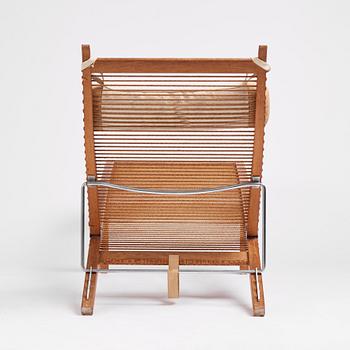 Hans J. Wegner, an oak lounge chair model "JH 524", Johannes Hansen, Copenhagen.