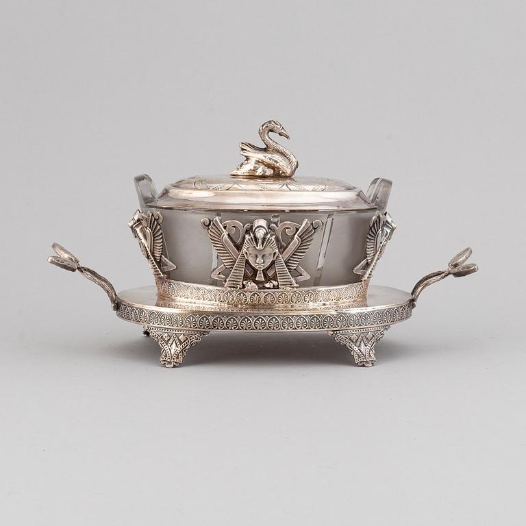 An 'Egyptian Empire style' silver plated caviar bowl with a blasted glass canister, ca 1900.