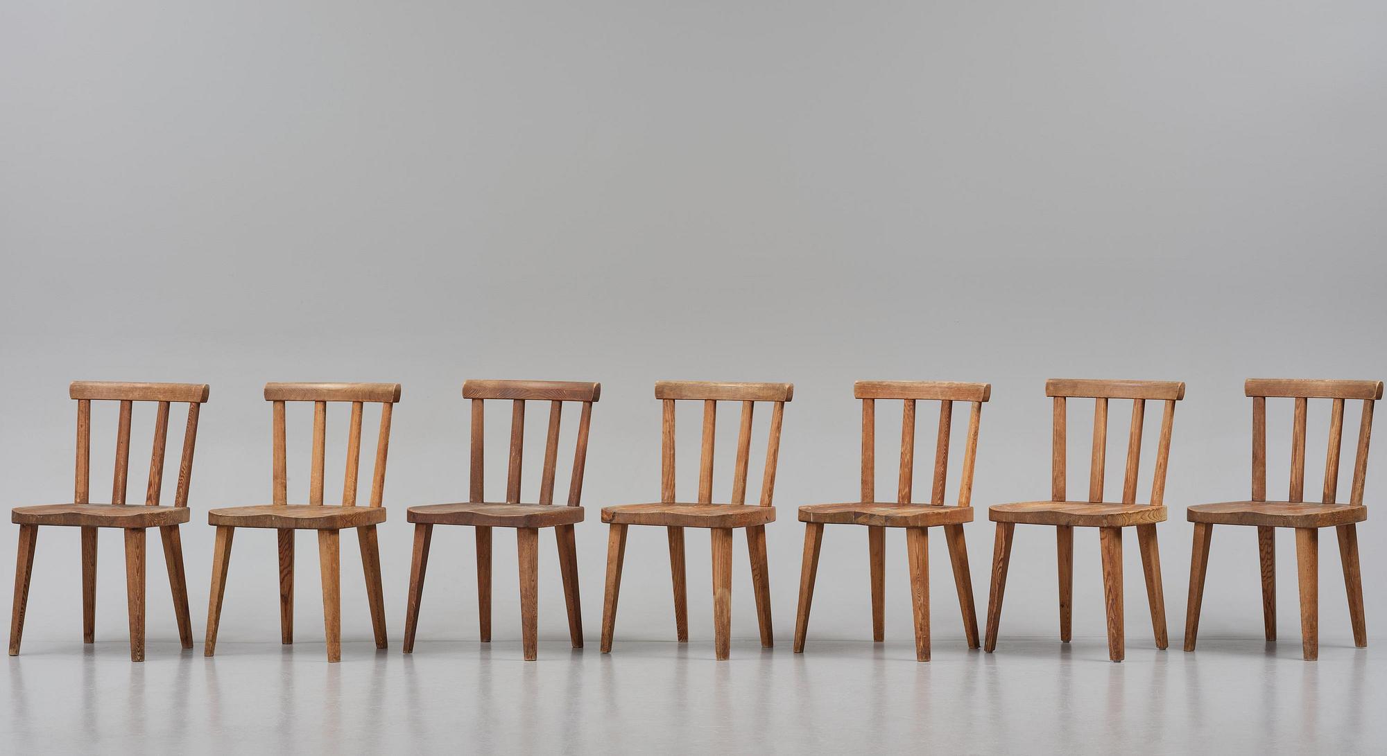 Axel Einar Hjorth, a set of seven stained pine "Utö" chairs, Nordiska Kompaniet, Sweden, 1930s.