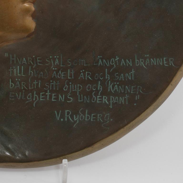 PLAKETT, brons, Gerda Sprinchorn, Ystad Brons, signerad och daterad 1899.