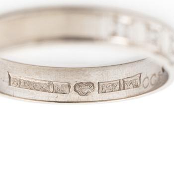 Half-eternity ring, 18K white gold with octagonal-cut diamonds.