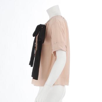 PRADA, a powder pink blouse with black ribbon. Size 40.