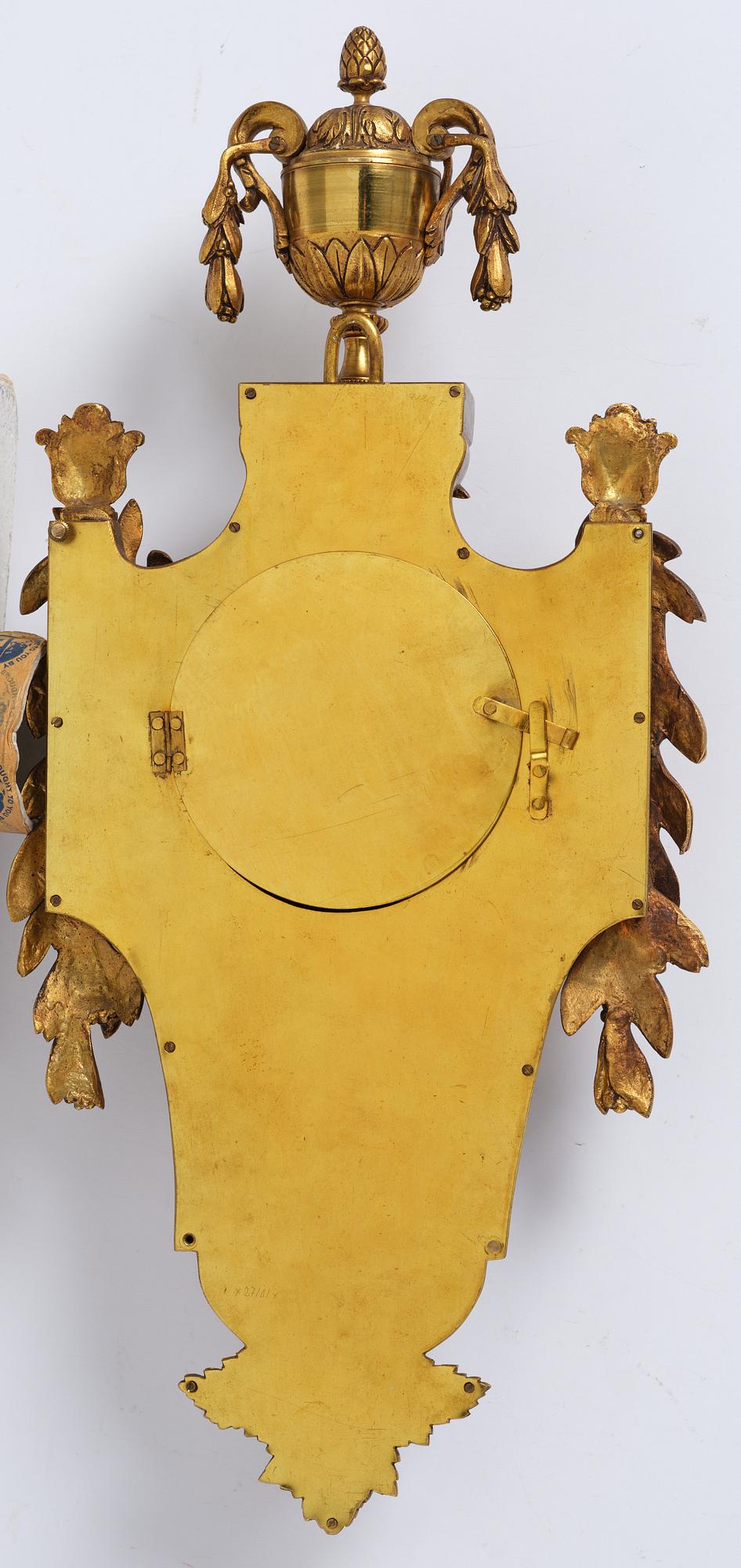 A French  Louis XVI-style wall clock, around 1900.