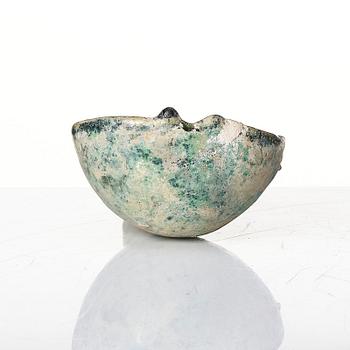 A painted pottery bell and a green glazed spoon, Han dynasty  (202 BC-220 AD).