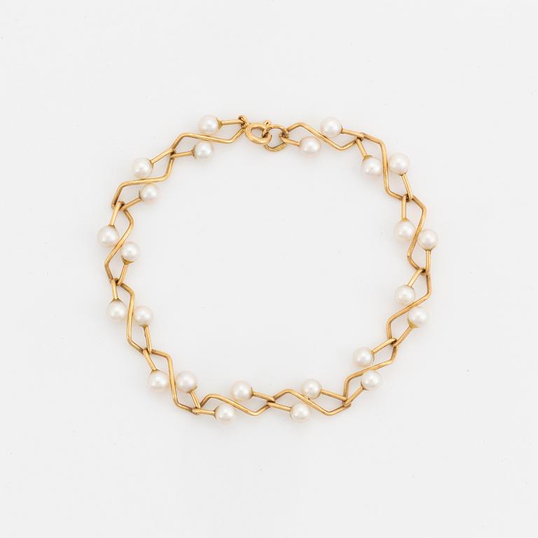 Armband, 18K guld med pärlor.