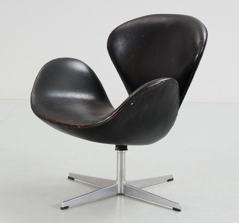 An Arne Jacobsen black leather 'Swan' easy chair, Fritz Hansen, Denmark 1960's.