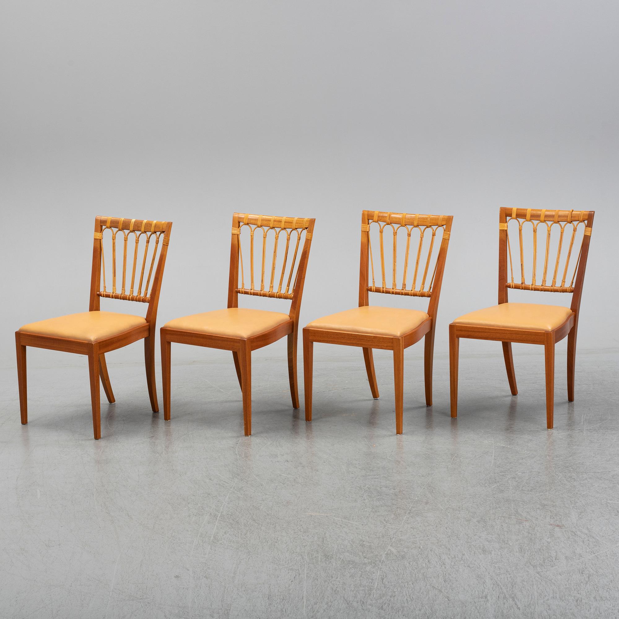 A set of four of Josef Frank mahogany and rattan dining chairs, Svenskt Tenn, Stockholm, Sweden.