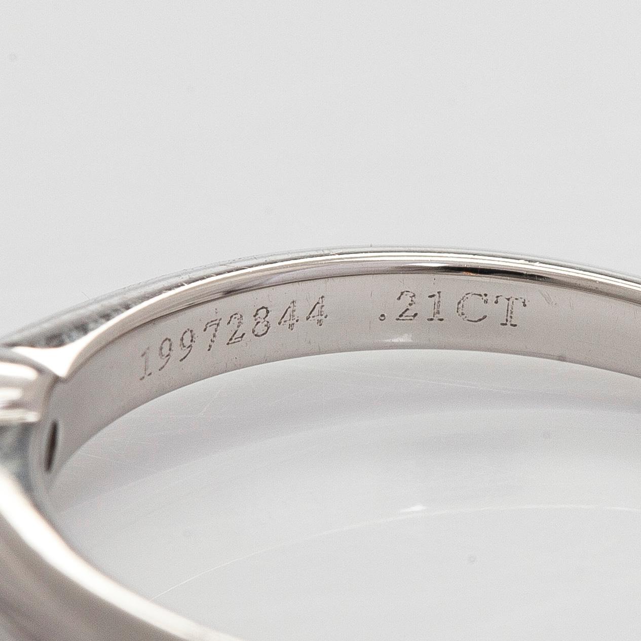 Tiffany & Co, a platinum solitaire ring with a brilliant-cut diamond.