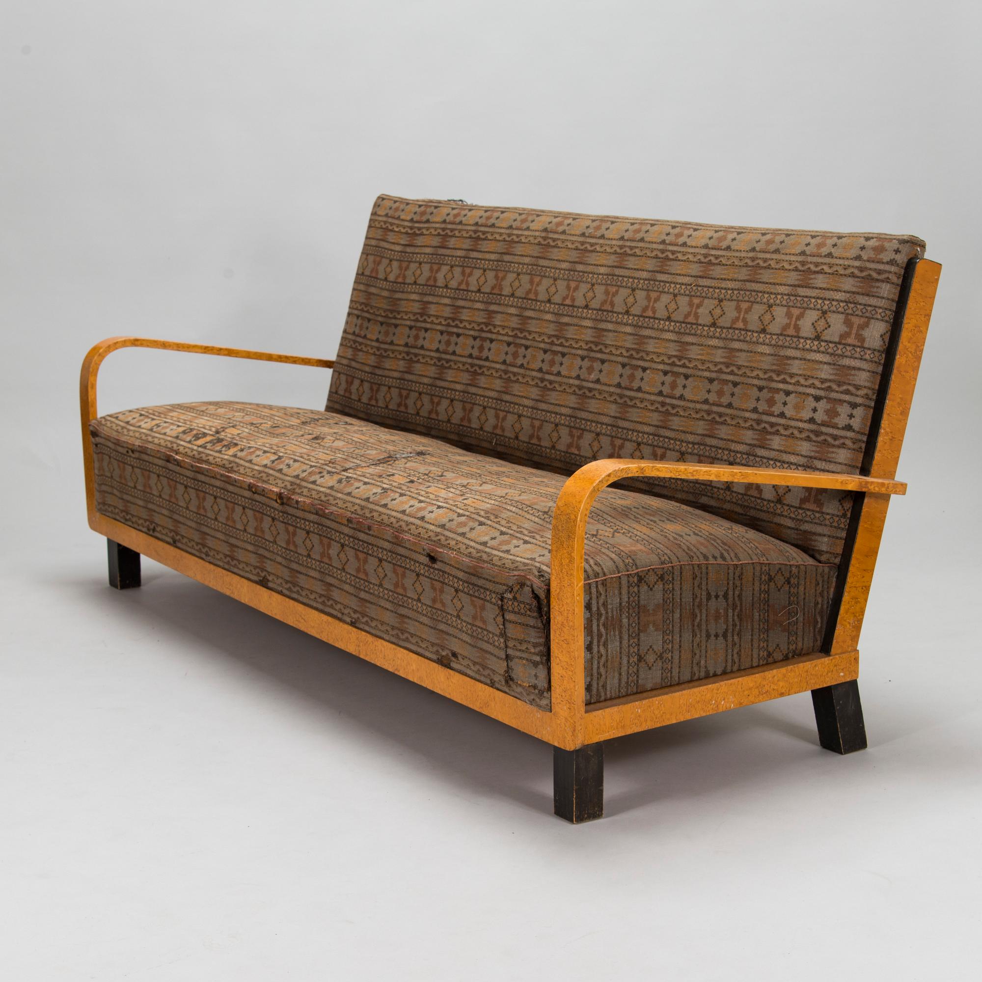 A  1920s Carelian birch veneered sofa.