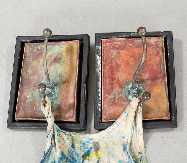 a wall sculpture, signed .