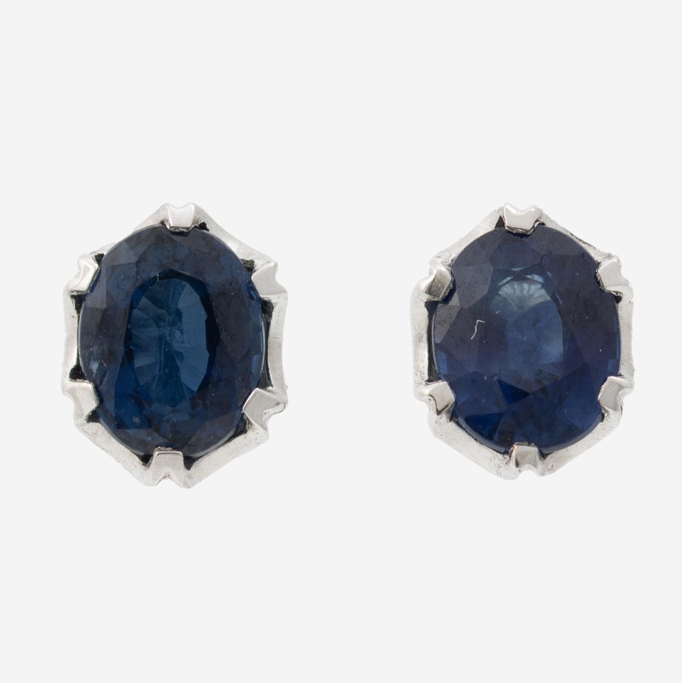 14K white gold earrings with faceted sapphires.