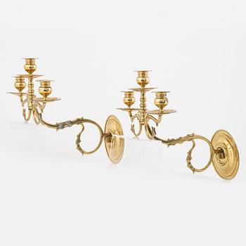 A pair of brass wall sconces, first half of the 20th Century.