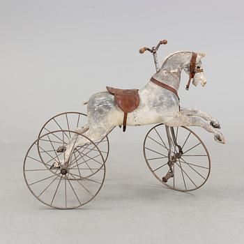 A wooden toy horse from the late 19th century.