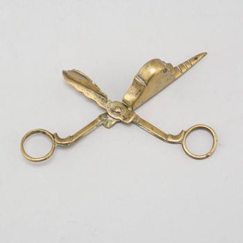 A 17th/18th century bronze candle scissors.