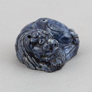 A blue glazed figure of a buddhist lion, Qing dynasty, Qianlong (1736-95).