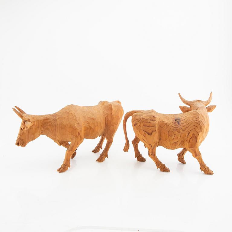 Olof Olsson, a pair of carved wooden sculptures signed.