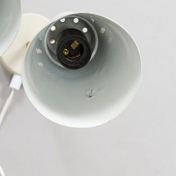 A set of three mid-20th century wall lights, model AH6, for Itsu Finland.