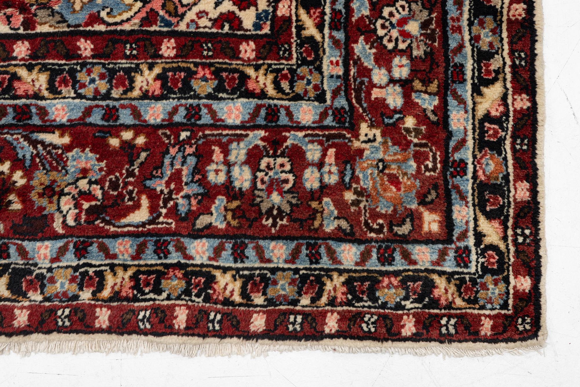 An oriental carpet, c. 370x260 cm.