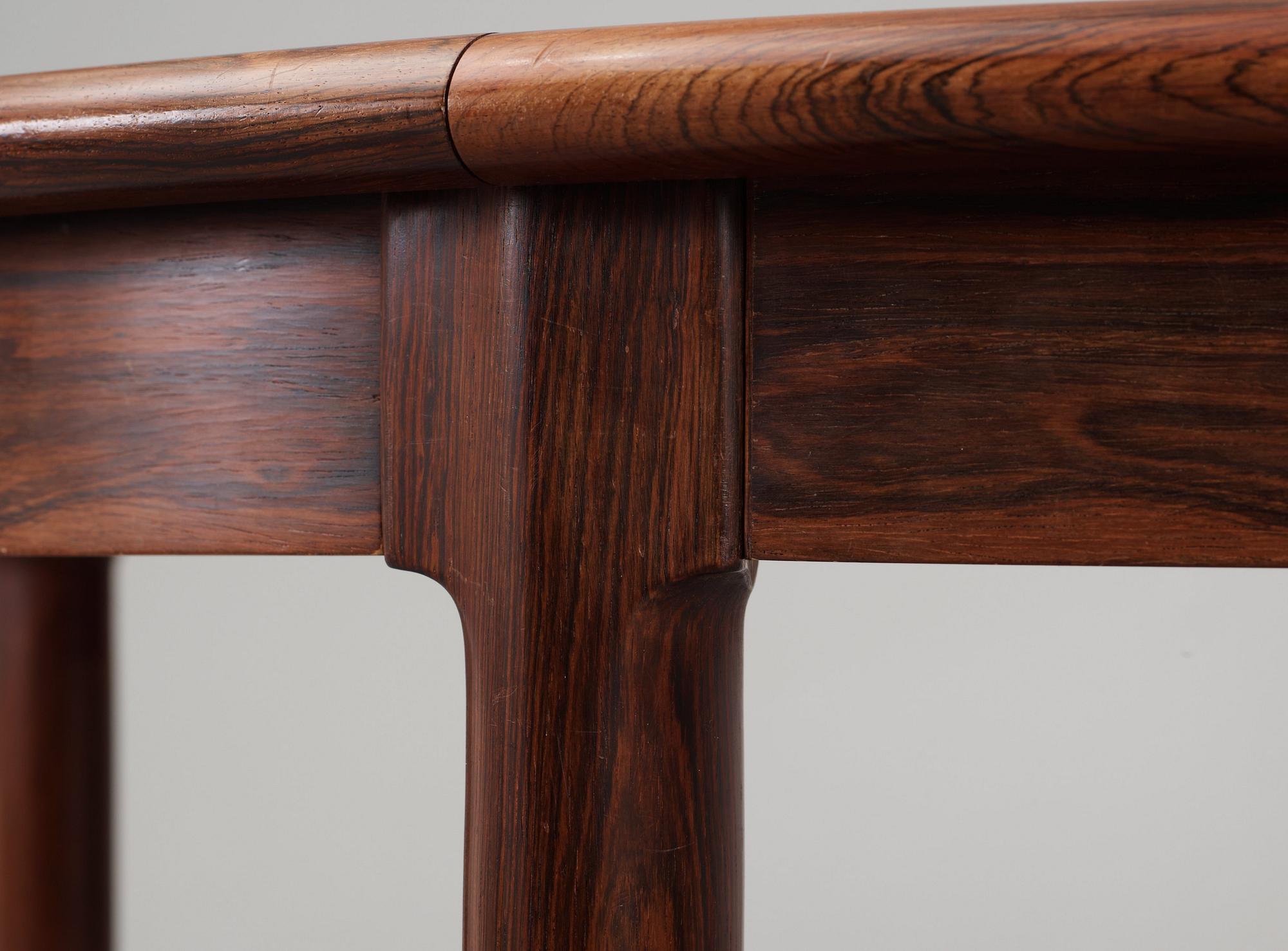 A Niels Ole Møller palisander dining table and nine chairs, J.L. Møller, Denmark 1950's-60's.