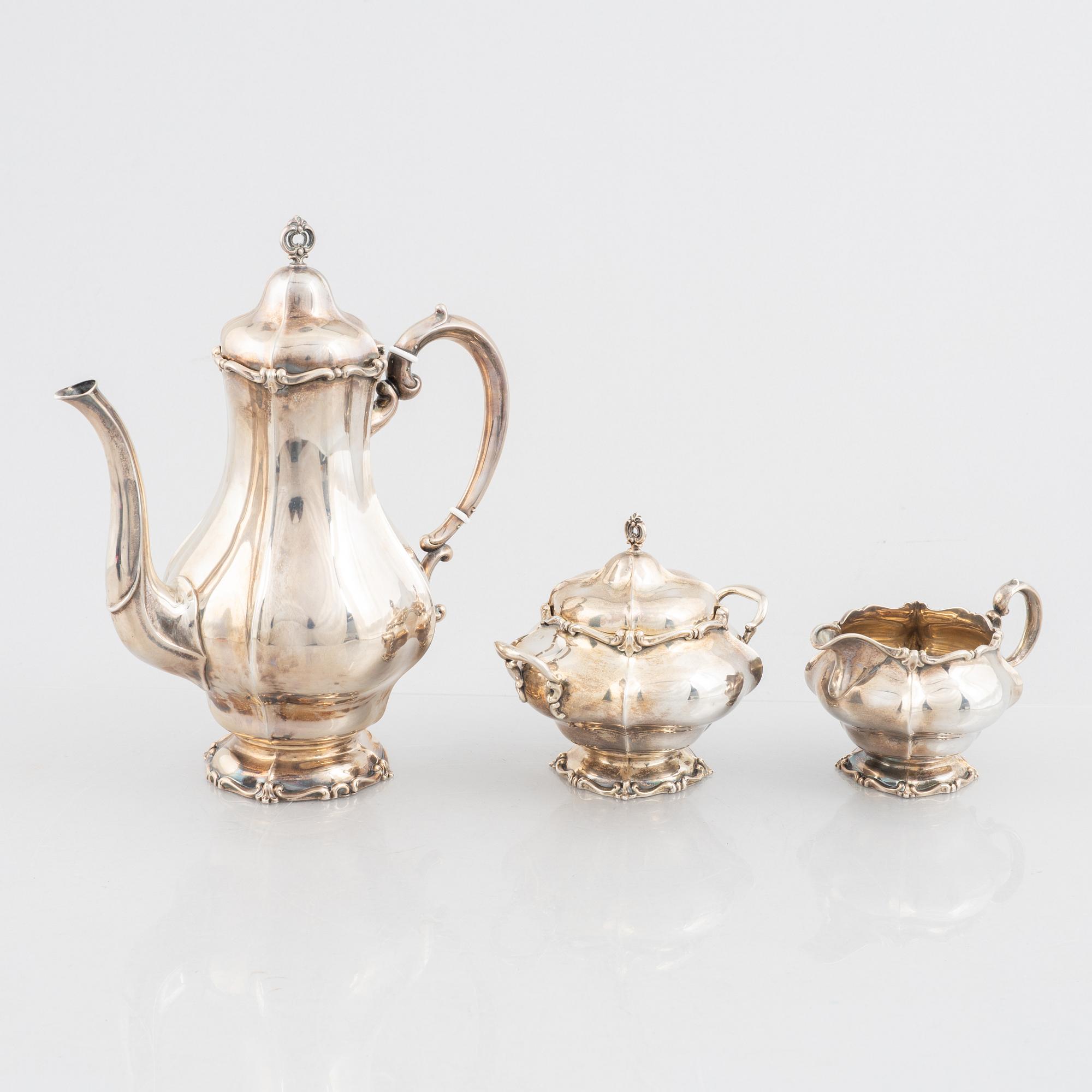A silver coffee pot, cream jug and sugar bowl, Swedish import marks Torndahl-Ekström, Stockholm 1921.