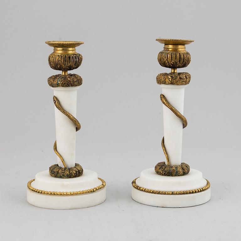 A pair of Louis XVI style candle sticks, circa 1900.