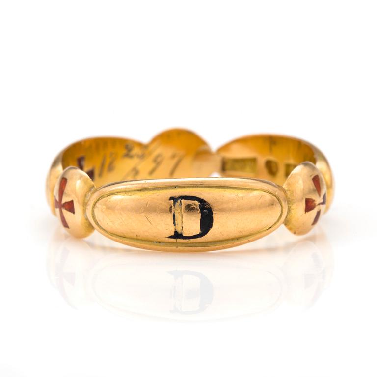 An 18K gold Masonic ring.