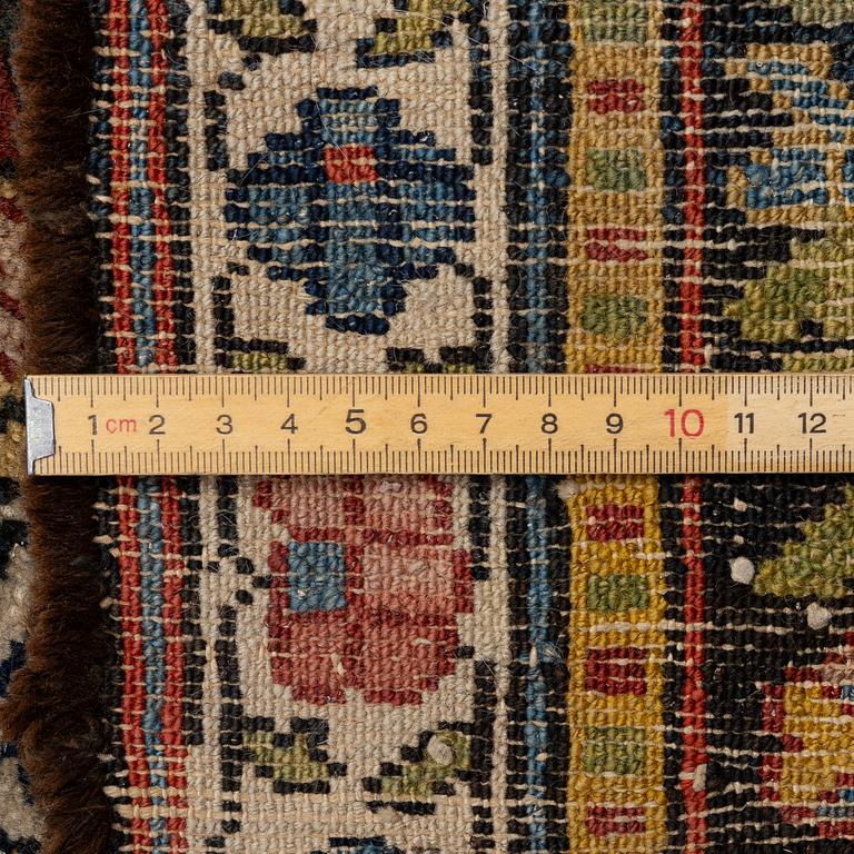 A Bakhtiari carpet, signed, c. 580 x 212 cm.