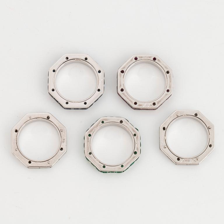 Five Paul Binder rings in 18K white gold set with baguette- and round brilliant-cut diamonds.