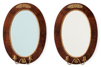 100. A pair of mahogany Empire two-light girandoles, early 19th century.