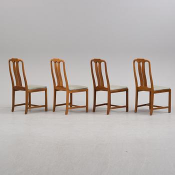 A Carl Malmsten "Ambassadör" dining table and four chairs  , second half of the 20th century. One extension leaf.