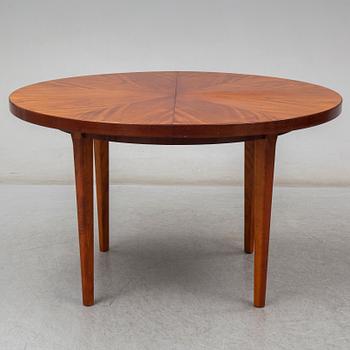 a mahogany dining table from the mid 20th century.