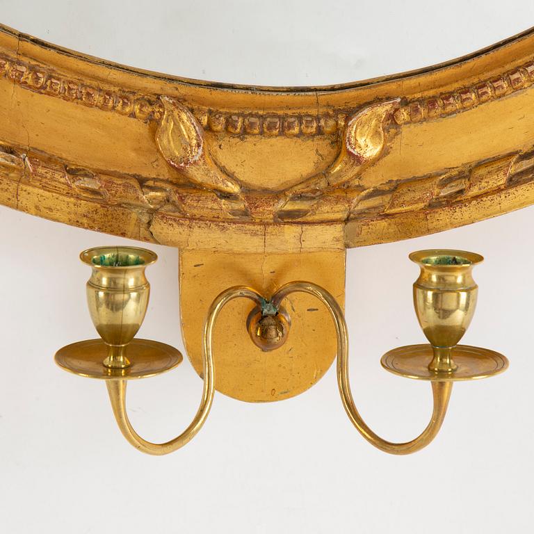 A Gustavian two-light girandole mirror, late 18th Century.