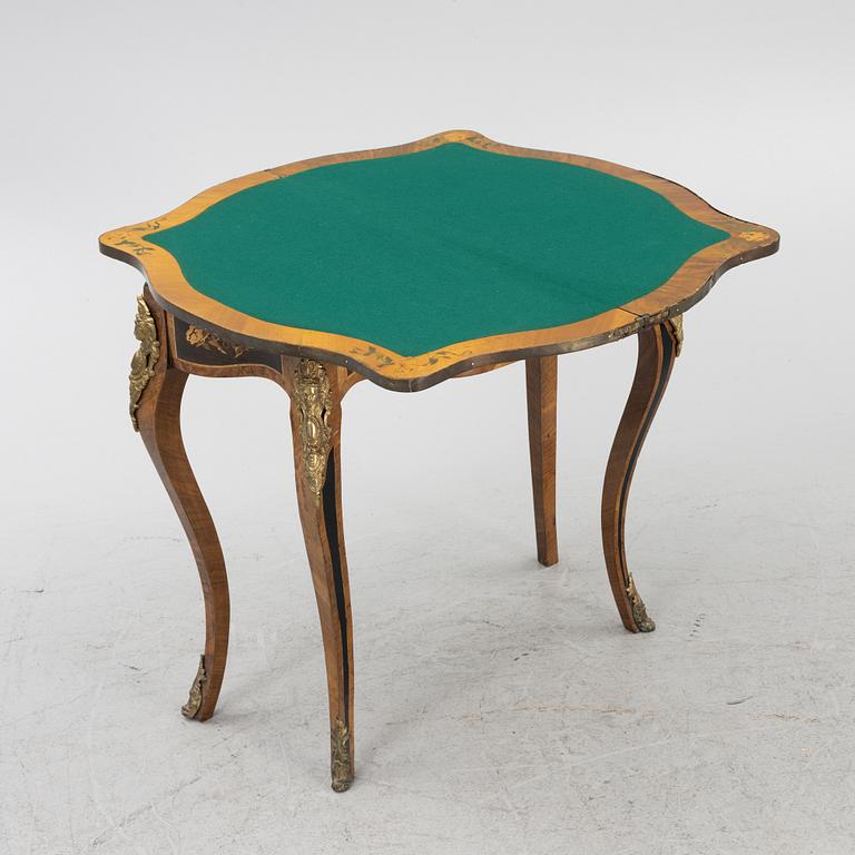 A Louis XV-style games table, early 20th century.