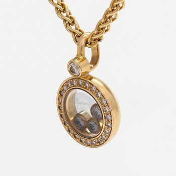 Chopard, an 18K gold 'Happy Diamonds' necklace with brilliant-cut diamonds.