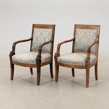 Armchairs, a pair in the Empire style, circa 1900.