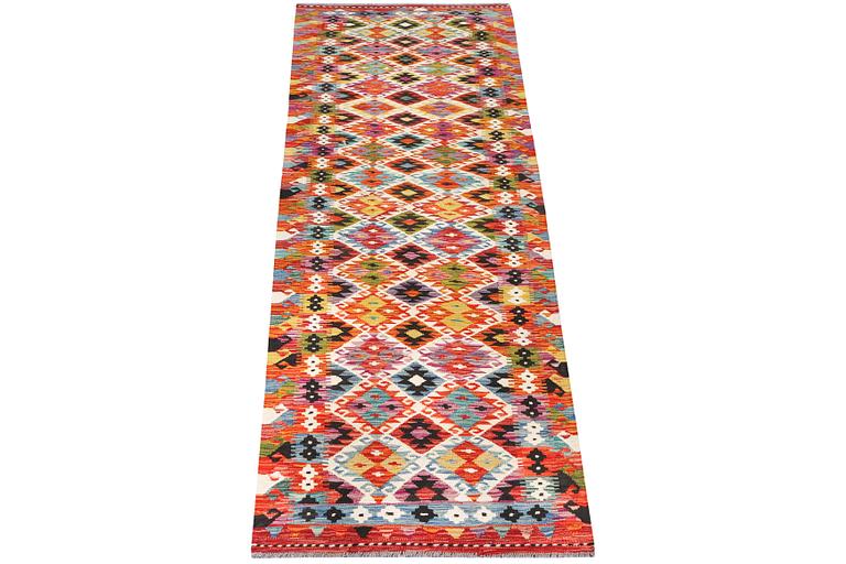 A Kilim runner carpet, c. 298 x 80 cm.