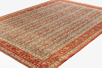 A carpet, semi-antique, Qum, ca 318 x 233 cm.