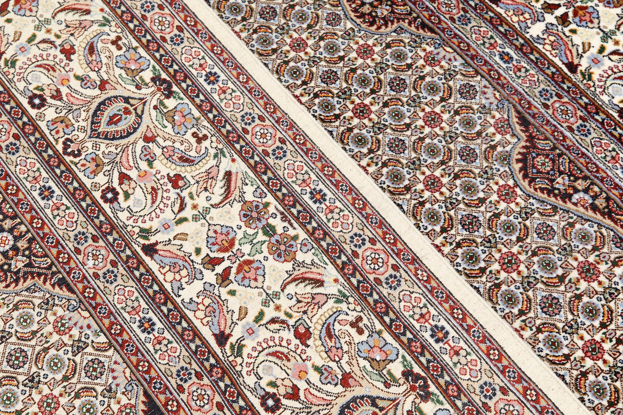 A part silk Moud carpet, approximately 350 x 252 cm.