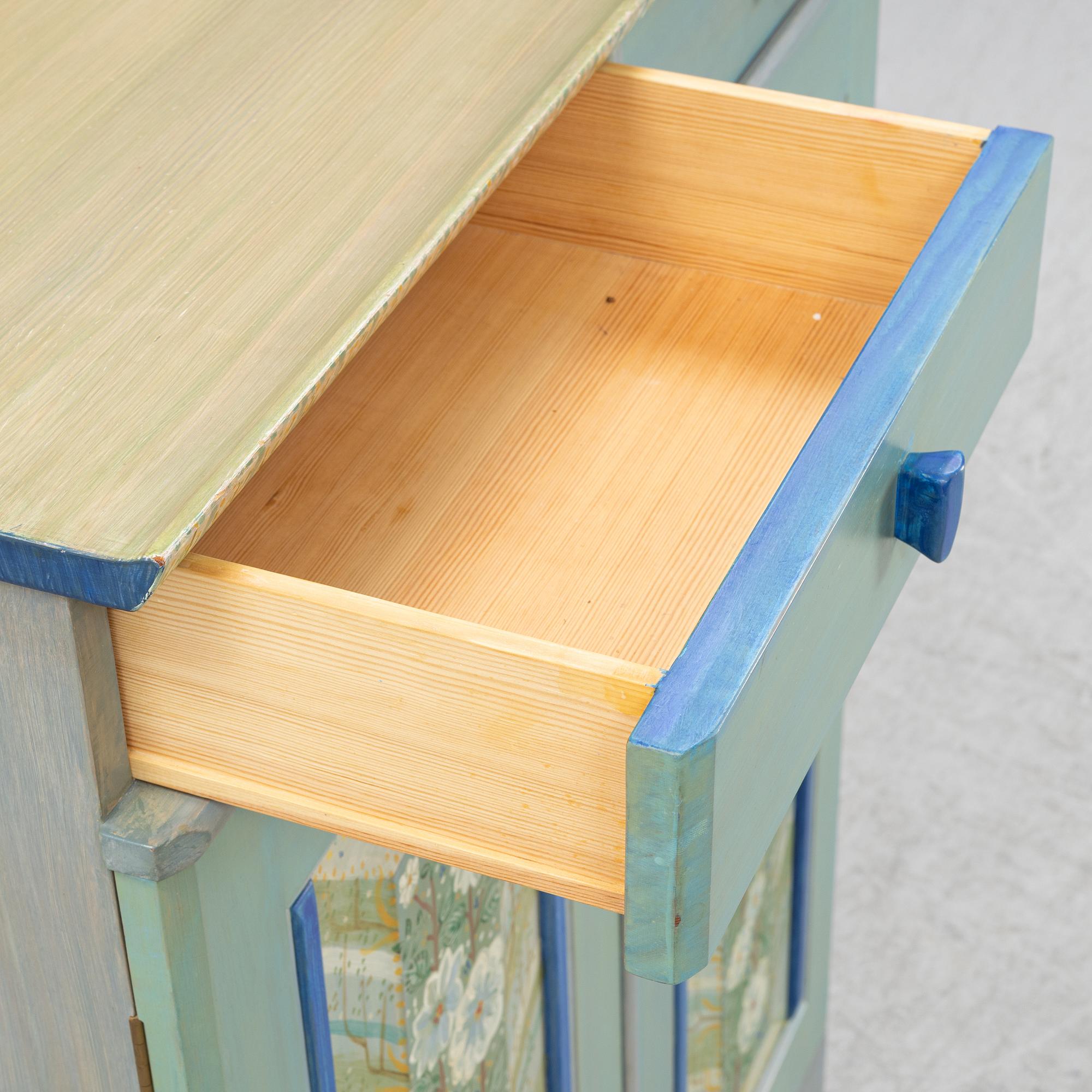 A 'Vita blommorna' cabinet/sideboard, painted by Liselott Malmsten, Firma Carl Malmsten, 1991.