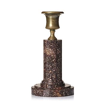 91. An Empire 'Blyberg' porphyry candlestick from Älvdalen, first part 19th century.