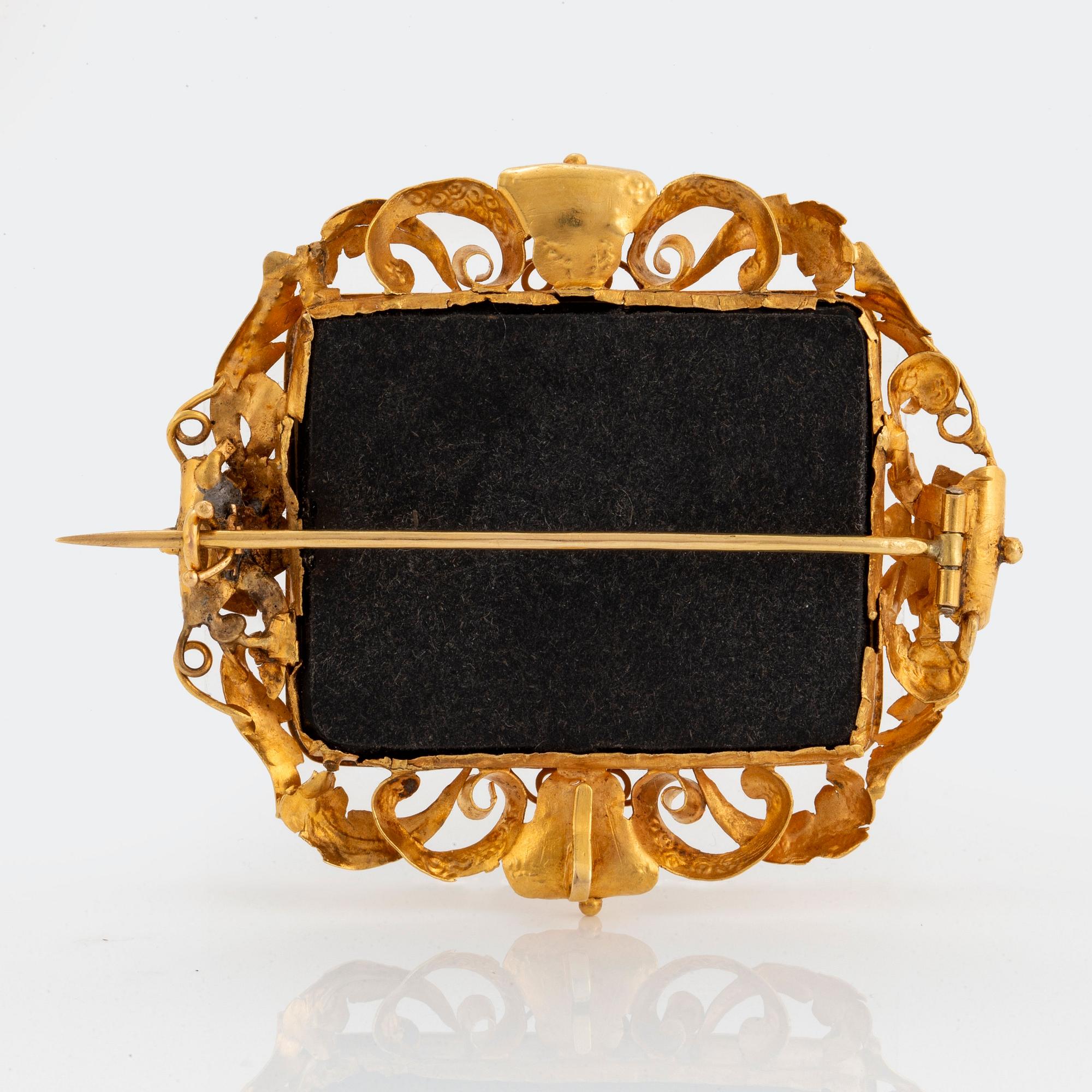 An 18K gold and micro mosaic brooch.