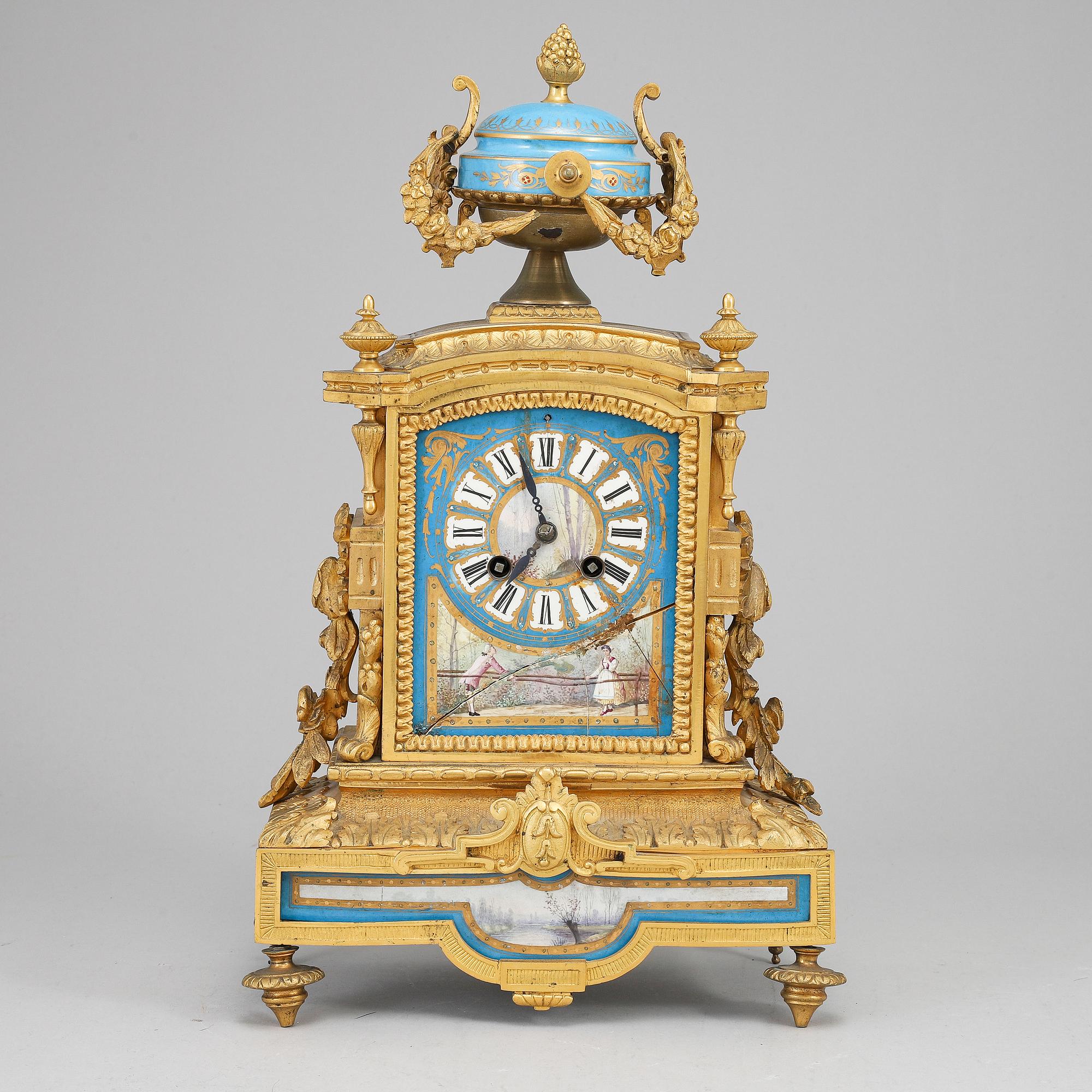 A late 19th Century bronze and porelain mantel clock.